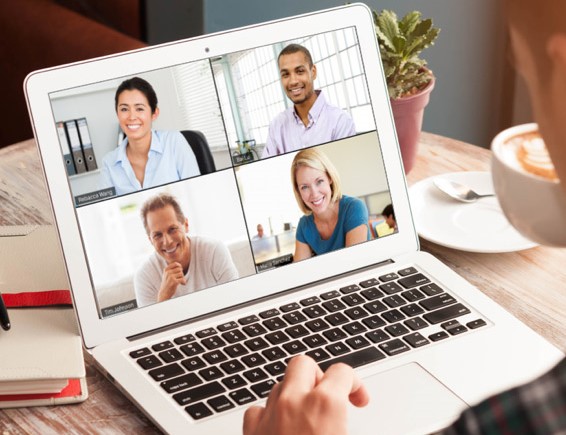 A photo showing someone on a video-call on their laptop